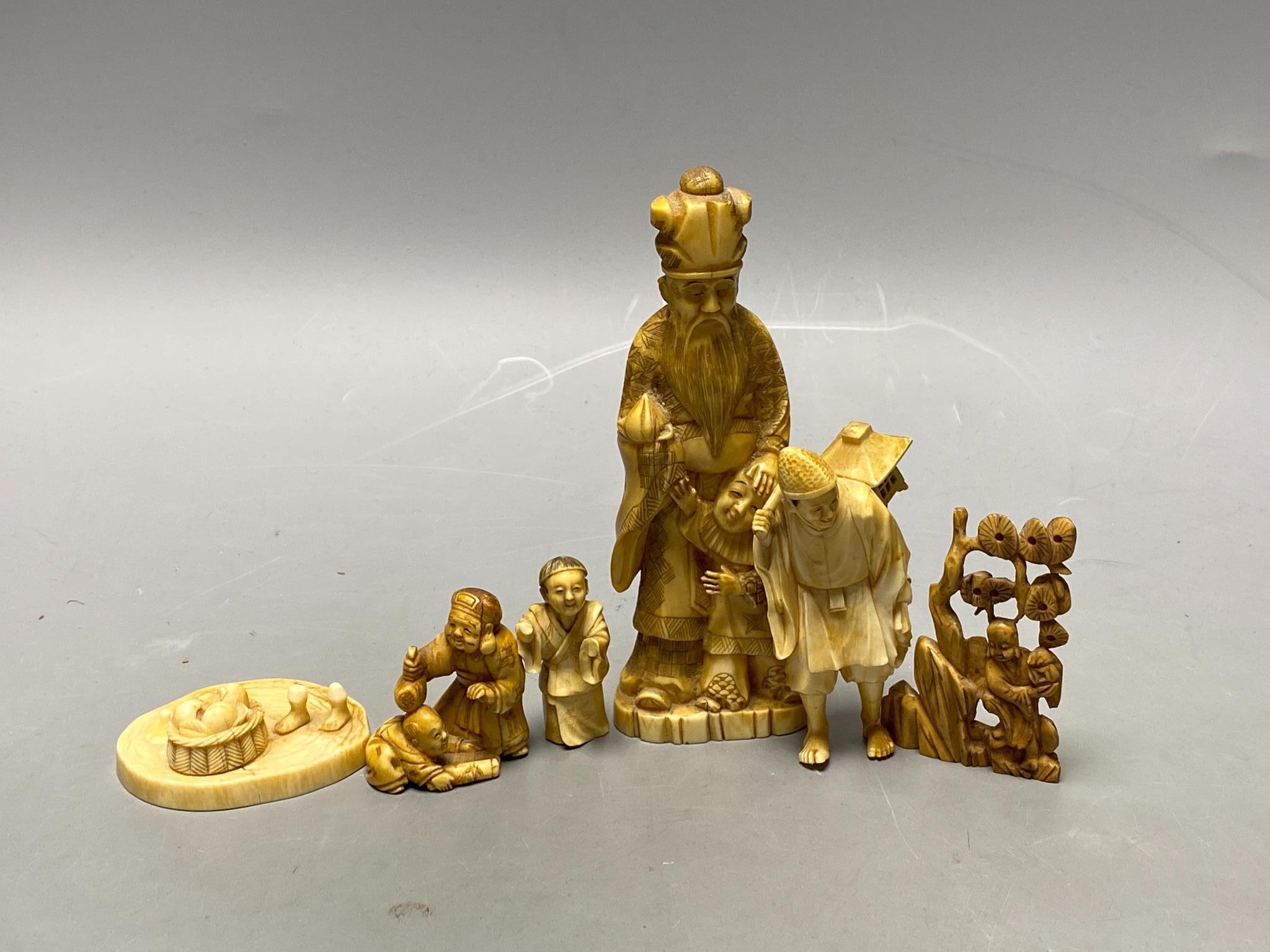 A Japanese walrus ivory group and an incomplete ivory okimono of group of Daikoku and a Chinese ivory carving (4)